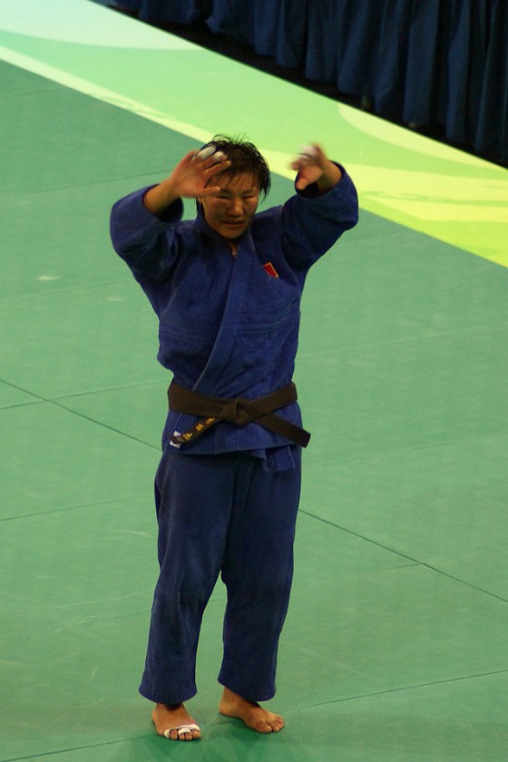 Judo Women's 78kg and Men's 100kg Final. Yang Xiuli in victory pose. Beijing. .