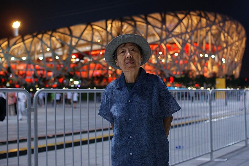 Night at the Olympic Green. Mother in front of the National Stadium. Beijing. .