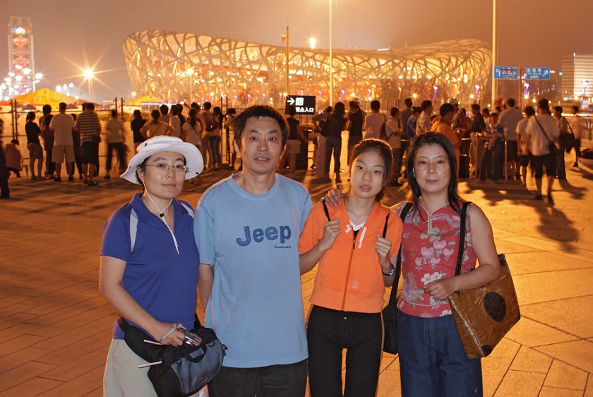 Rowing Finals. Brother, sister-in-law and niece in front of the National Stadium and the Linglong Tower. Beijing. .