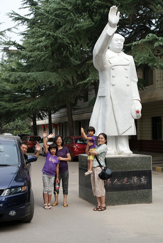 Liquan Yuan Village. Friend's Family with Mao Statue. Liquan Yuan. .