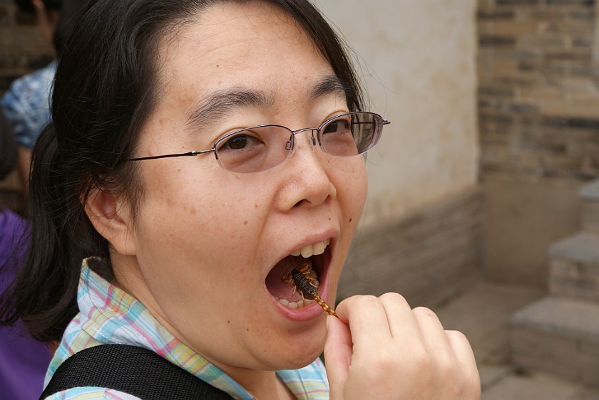 Liquan Yuan Village. Eating a Scorpion. Liquan Yuan. .