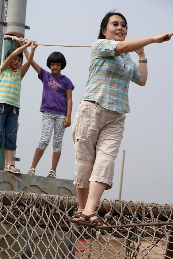Liquan Yuan Village. Balancing on a Rope. Liquan Yuan. .