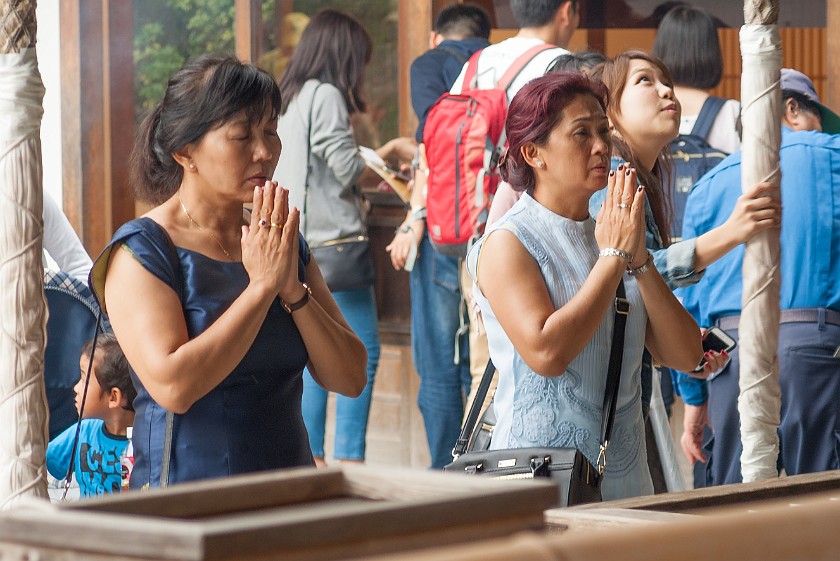 Kinkaku-Ji. Women praying at the temple. Kyoto. .