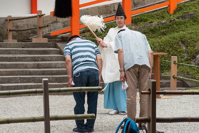 Nara. Shintō priest blessing two men. Nara. .
