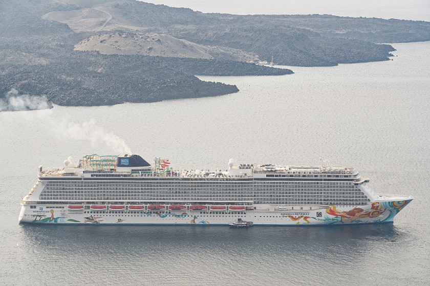 Oia, Santorini. Cruise ship and Nea Kameni island. Fira. .