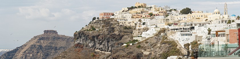 Fira, Santorini. Panoramic view on the Skaros rock and St. John the Baptist cathedral. Fira. .