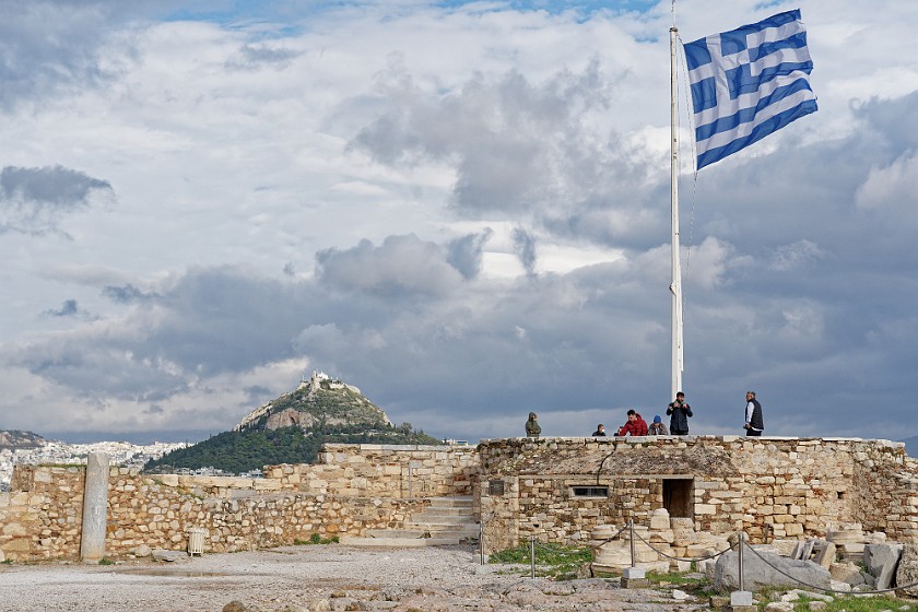 Acropolis of Athens. Greek flag and Lycabettus hill. Athens. .