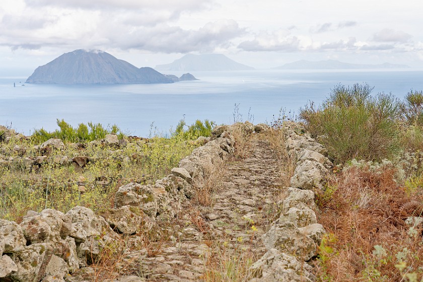 Hiking on Alicudi. Hiking path with Filicudi, Salina and Lipari in the background. Alicudi. .