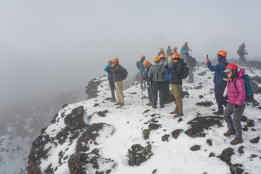 Hiking in the Etna North Area. Tourists on the crater rim. Linguaglossa. .